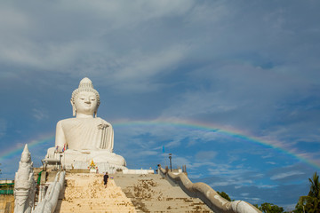 amazing rainbow cover Phuket big Buddha..Phuket Big Buddha is one of the island most important and revered landmarks on the island..time lapse rainbow above Phuket big Buddha © Narong Niemhom