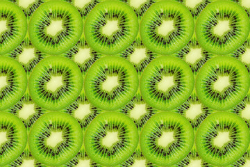 Slice of green raw kiwi fruit background