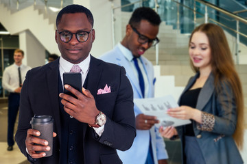 Portrait of ambitious business team diverse ethnicity multinational people in stylish suit getting communicating together in lobby of modern the office .