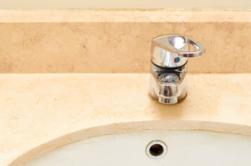 marble sink with chromed faucet, bathroom background