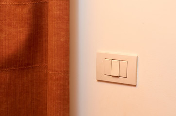 white light switch on the wall in the room