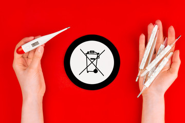 Danger glass human body mercury thermometers compare to safety electric body thermometers on red...