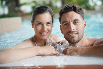 Couple relaxing in spa resort pool