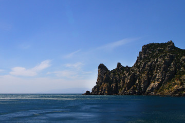 Fototapeta na wymiar beautiful natural landscape photo of sea and mountains with bright blue sky