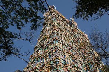 Meenakshi hindu temple in Madurai, Tamil Nadu, South India. Sculptures on Hindu temple gopura (tower). It is a twin temple, one of which is dedicated to Meenakshi, and the other to Lord Sundareswarar