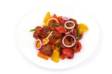 Ciambotta Chinese cuisine. Chinese spiced beef with vegetables in a plate. Isolated on white background. Top view.