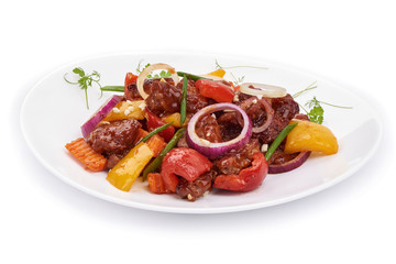 Tradicional Chinese recipes WOK. Roast Sweet and Sour Pork with vegetables in a plate. Isolated on white background