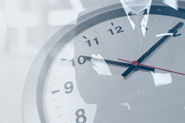 Time clock with business man for working hours or waiting concept