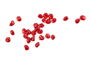 Seeds of pomegranate isolated on white background. Top view. - obrazy, fototapety, plakaty