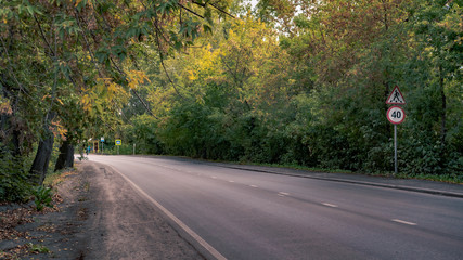 The turn of the road autumn forest road sign