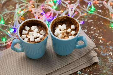 hot chocolate and garland lights  on the table