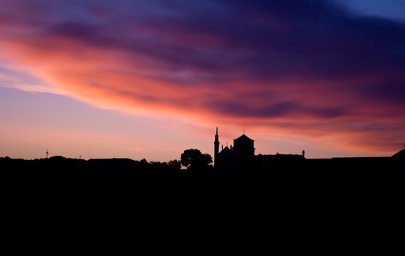 Silhouettes of the city of Kamenetz-Podolsky against the background of a multi-colored dawn sky