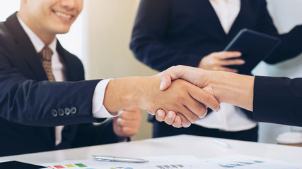 close up hand of marketing manager employee pointing at business document during discussion at meeting room - Business concept