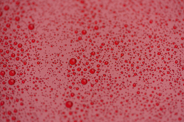 raindrops on ceramic coated red car with hydrophobic effect