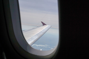 Fototapeta na wymiar The window of the plane taken from the outside.