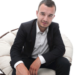 young businessman sitting in a comfortable chair