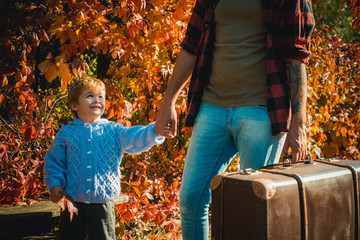 Child love. Parent teach baby. Man with beard, dad with young son in autumn park. We like autumn...