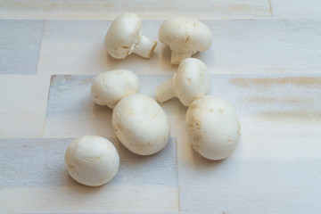 Mushrooms on wooden background