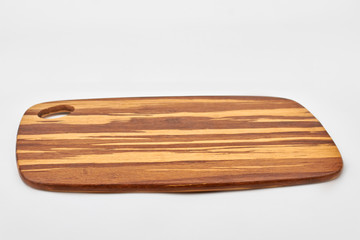 Wooden cutting board. Blank handmade cutting board made of wood. Natural kitchen utensil.