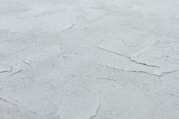 Gray stone background texture. Gray patterned surface wallpaper. Abstract seamless background.