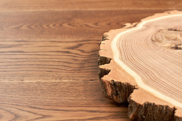 Wooden slice with bark. Blank wooden disc for decoration, top view. Timber for creative DIY.
