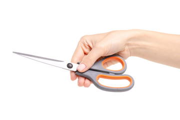 Scissors in hand on white background. Isolation.
