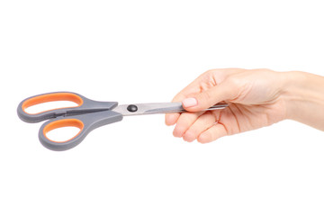 Scissors in hand on white background. Isolation.