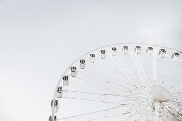 Ferris wheel on sky background.