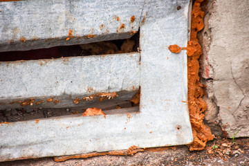 Crumpled metal grate basement with mounting foam