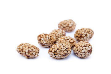 Coated peanuts with sesame isolated on white background