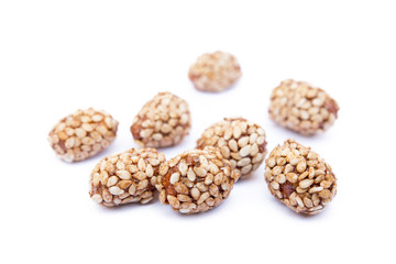 Coated peanuts with sesame isolated on white background