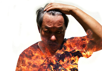 Double exposure of Asian men and flame, Fire erupts in the body of an angry man isolated on white background, Stress in the mind affects the body, Psycho savage human, Insanity face and fierce eye
