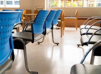 Empty chairs in a row of the reception room.