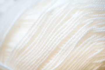 white yarn close-up shot. Woolen threads for knitting  macro