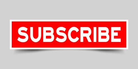 Red color sticker in word subscribe on gray background