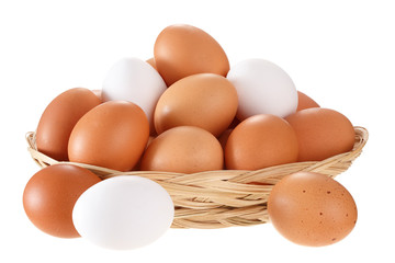 Eggs in a wicker basket. Isolated on white background.