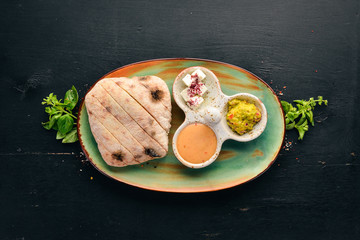 Breakfast. Fried eggs. Top view. Free space for your text. On a wooden background.