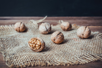walnuts and sackcloth on wooden table