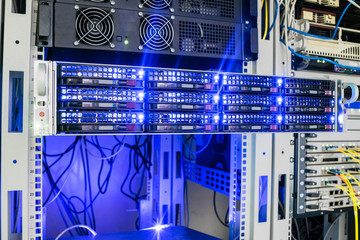 Access server close-up. Computer equipment with bright indication is installed in the rack of the server cabinet of the data center. Concept of computer Internet technologies.