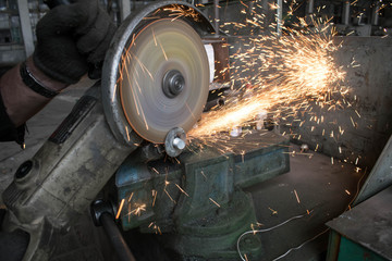 turning works threading on the factory machine spark from the grinding wheel for design