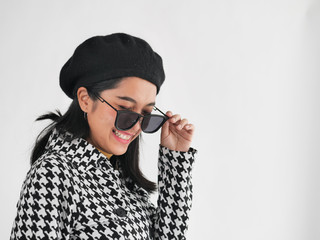 Portrait of Asian woman wearing winter jacket and sunglasses, winter lifestyle fashion.