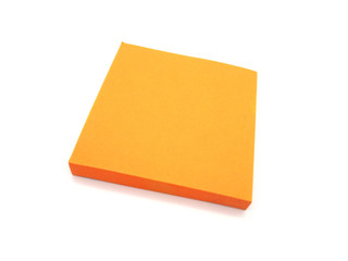 Orange paper stick note on a white background.