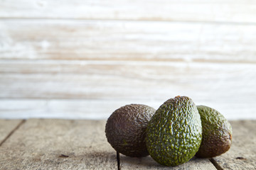 Avocado on old wooden background