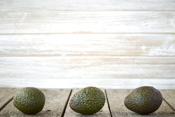 Avocado on old wooden background