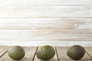 Avocado on old wooden background