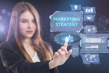 The concept of business, technology, the Internet and the network. A young entrepreneur working on a virtual screen of the future and sees the inscription: marketing strategy