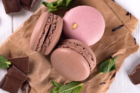 Chocolate And Macaroons On Old Kitchen Table. Top View