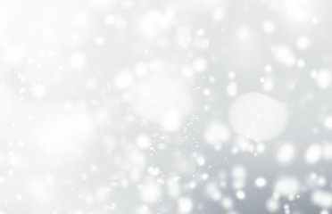 Silver  abstract bokeh background with snowflake and white glittering bokeh stars. A shiny holiday...