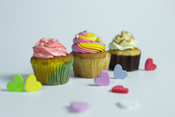 Colorful cupcakes on a white background