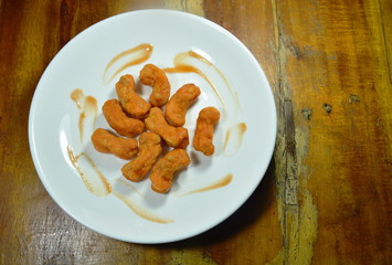 crispy fried mashed chicken meat dressing ketchup on plate